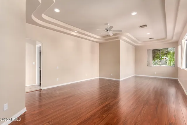 a view of a workspace with furniture and a flat screen tv