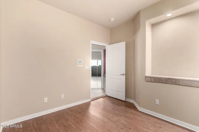 a utility room with granite countertop cabinets washer and dryer