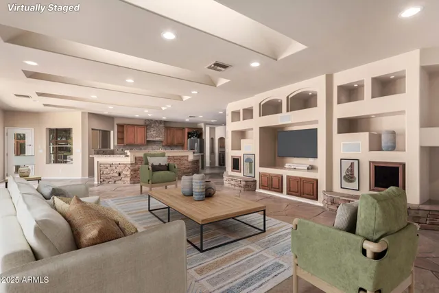 a large kitchen with a large counter top a sink stainless steel appliances and cabinets