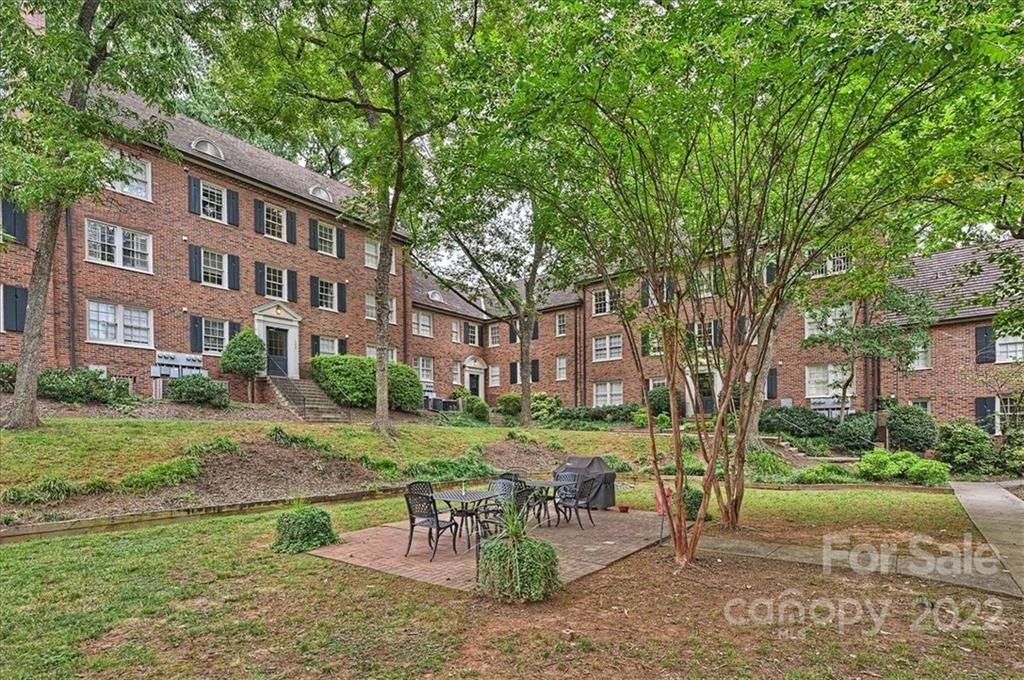 104 Colville Road, Unit 41C Charlotte, NC 28207 - Photo 17 of 22 a view of a building with a garden and sitting area