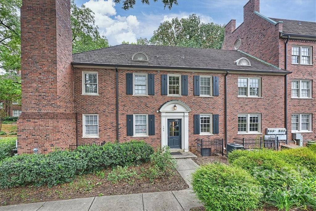 104 Colville Road, Unit 41C Charlotte, NC 28207 - Photo 20 of 22 a front view of a house with a garden