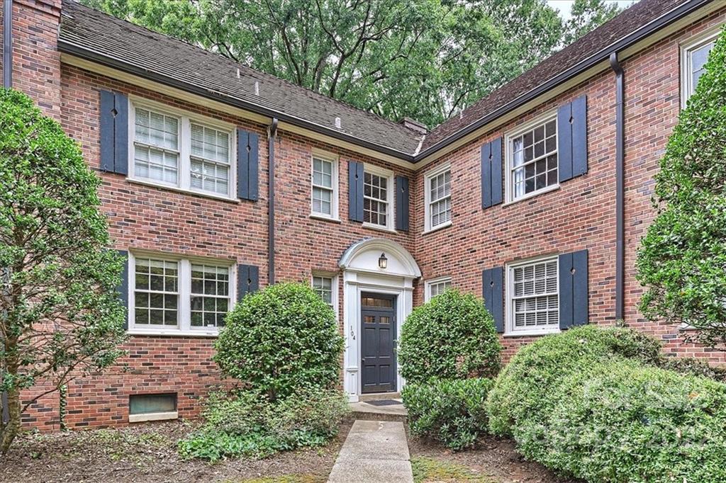 104 Colville Road, Unit 41C Charlotte, NC 28207 - Photo 2 of 22 a front view of a house with garden