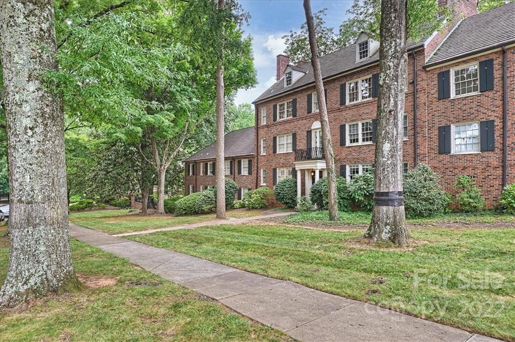 104 Colville Road, Unit 41C Charlotte, NC 28207 - Photo 21 of 22 a front view of a house with a yard