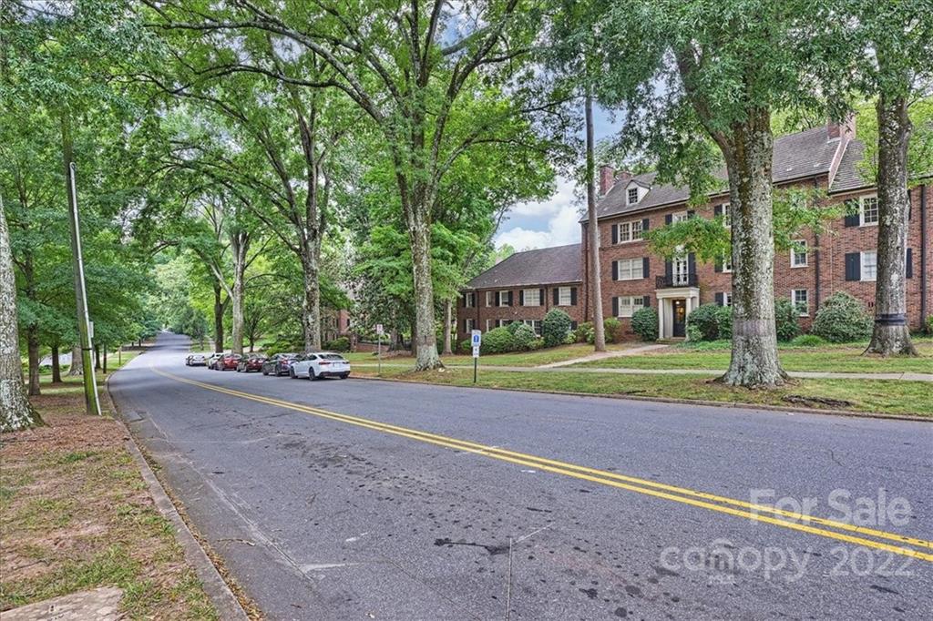 104 Colville Road, Unit 41C Charlotte, NC 28207 - Photo 22 of 22 a view of a house with a big yard and large trees