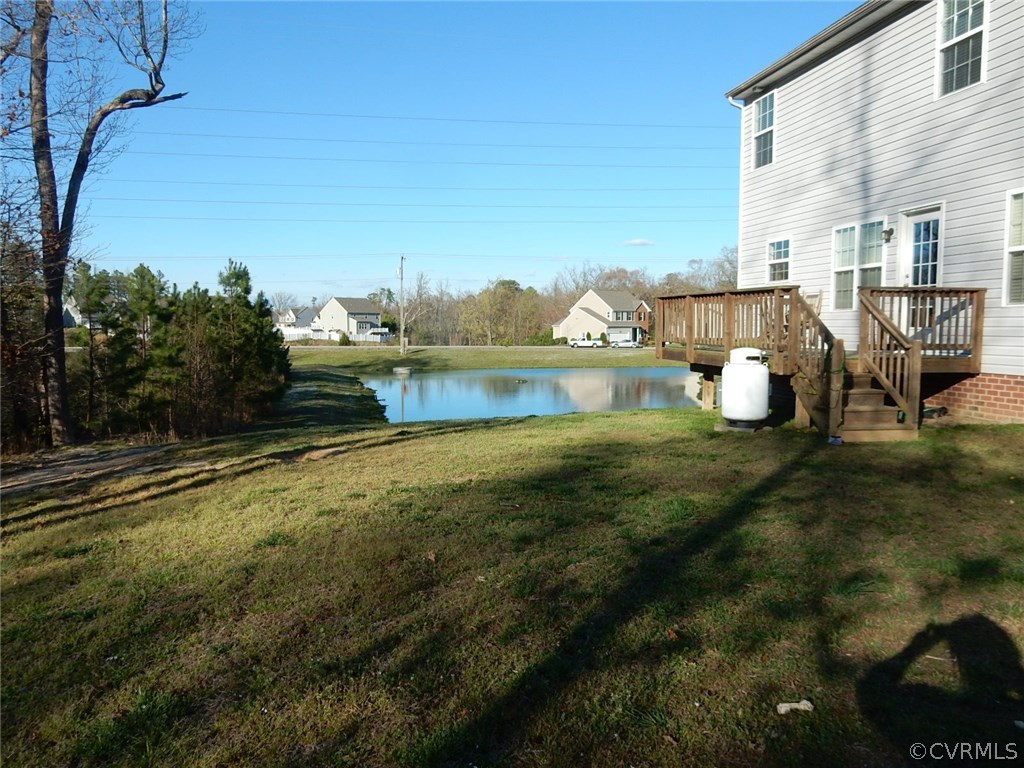 4110 Cameron Road Hopewell, VA 23860 - Photo 20 of 20 a backyard of a house with table and chairs