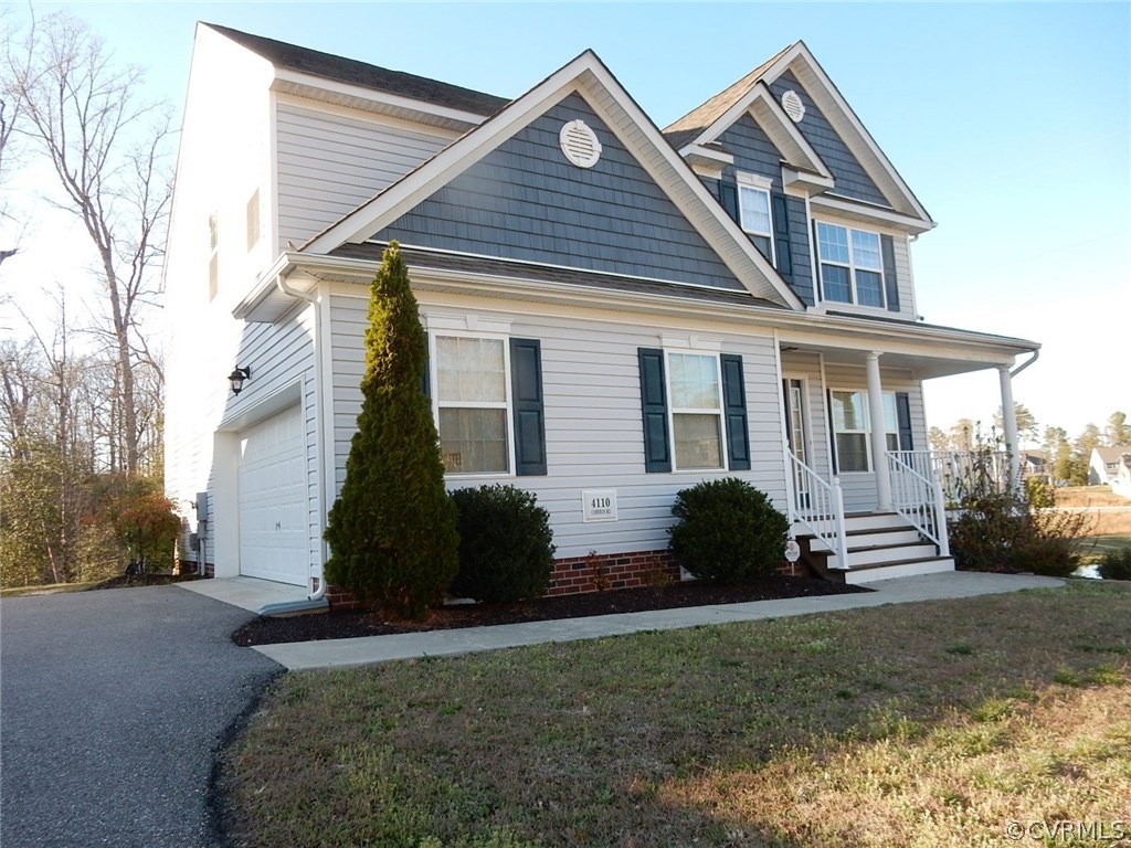 4110 Cameron Road Hopewell, VA 23860 - Photo 3 of 20 a front view of a house with a garden