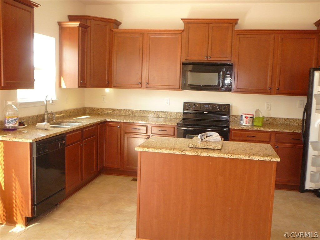 4110 Cameron Road Hopewell, VA 23860 - Photo 6 of 20 a kitchen with stainless steel appliances granite countertop a sink stove and microwave
