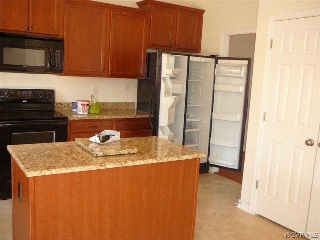 4110 Cameron Road Hopewell, VA 23860 - Photo 7 of 20 a kitchen with stainless steel appliances granite countertop a refrigerator a stove and a sink
