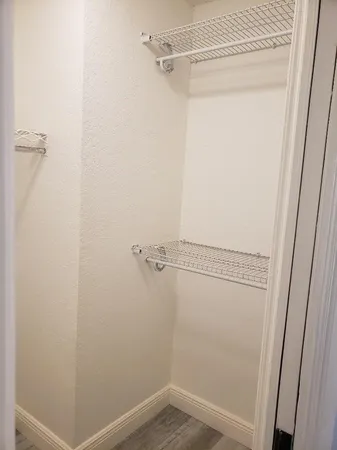 a view of a room with racks on the wall