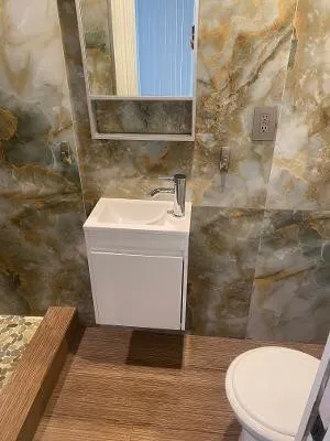 a bathroom with a toilet and a sink