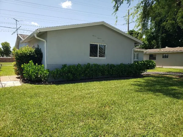 a house view with a garden space