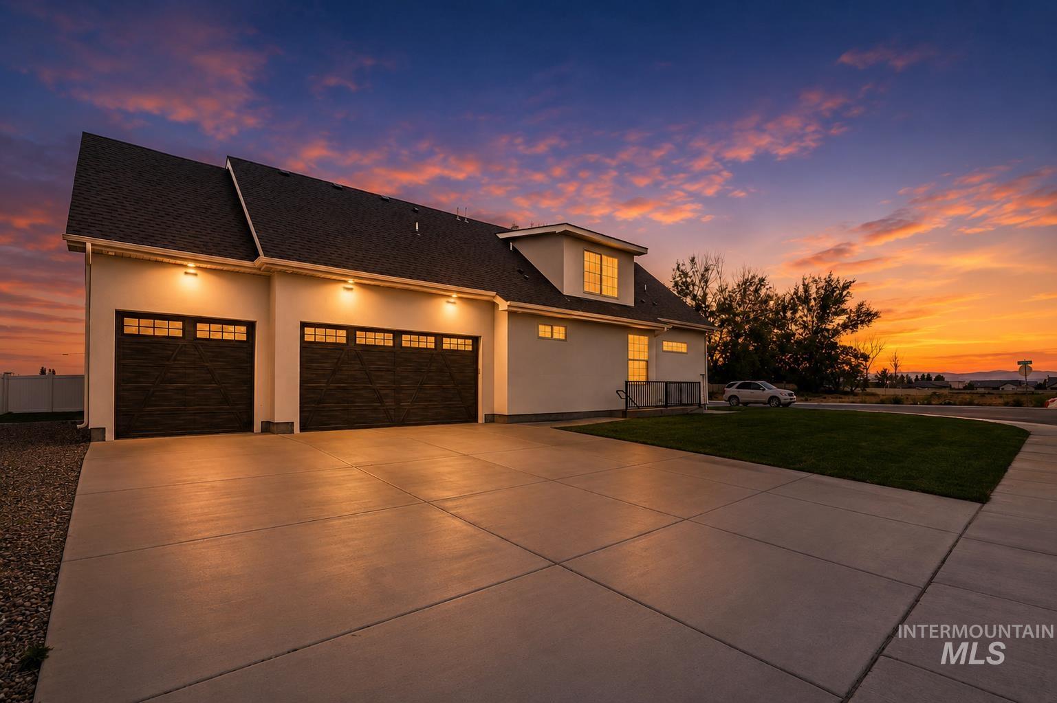 866 Quartz Road Kimberly, ID 83341 - Photo 4 of 48 Exterior featuring a multi-car garage with dark wood-finish doors and transom windows