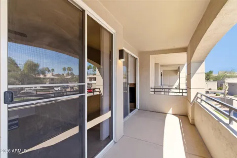 a kitchen with stainless steel appliances kitchen island granite countertop a refrigerator and a stove