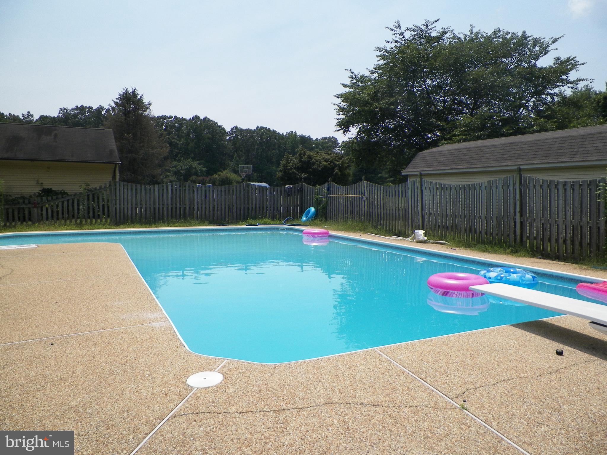 3151 Carroll Road Huntingtown, MD 20639 - Photo 2 of 30 a view of swimming pool with a yard