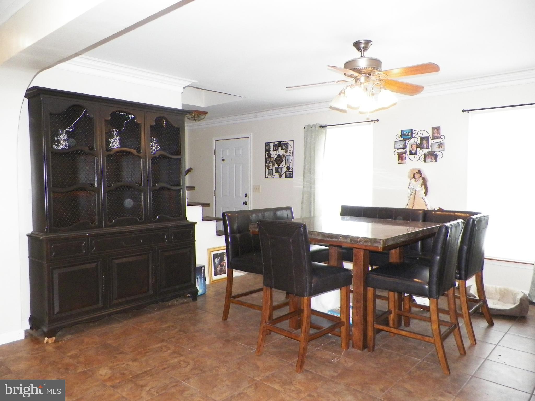 3151 Carroll Road Huntingtown, MD 20639 - Photo 11 of 30 a dining room with a table and chairs