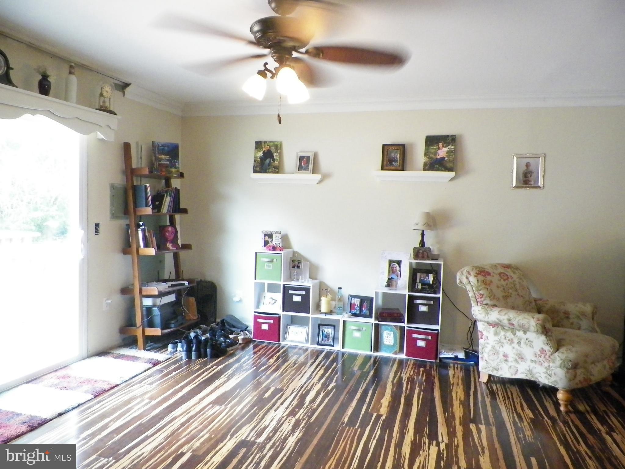 3151 Carroll Road Huntingtown, MD 20639 - Photo 14 of 30 a living room with furniture and a couch