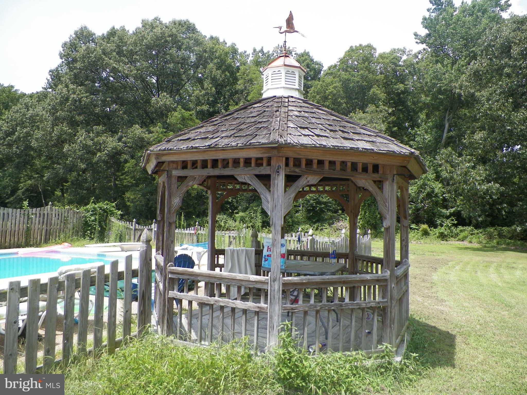 3151 Carroll Road Huntingtown, MD 20639 - Photo 18 of 30 a view of a wooden deck with furniture