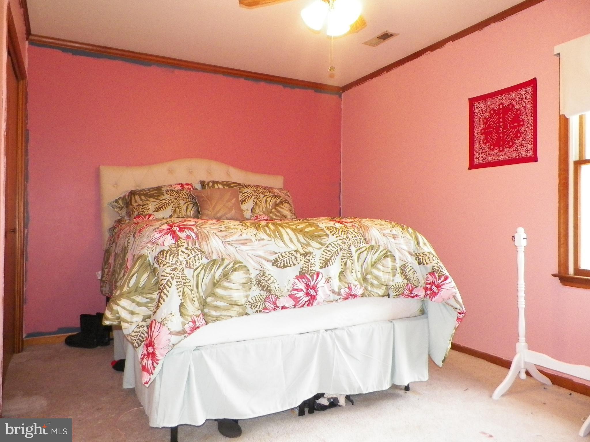 3151 Carroll Road Huntingtown, MD 20639 - Photo 19 of 30 a bedroom with a bed and a couch