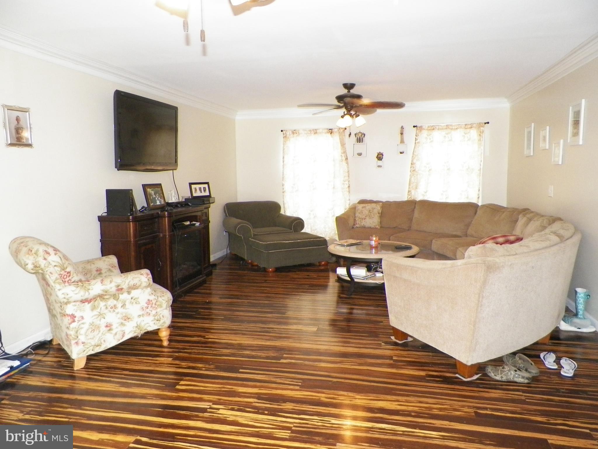 3151 Carroll Road Huntingtown, MD 20639 - Photo 5 of 30 a living room with furniture and a flat screen tv