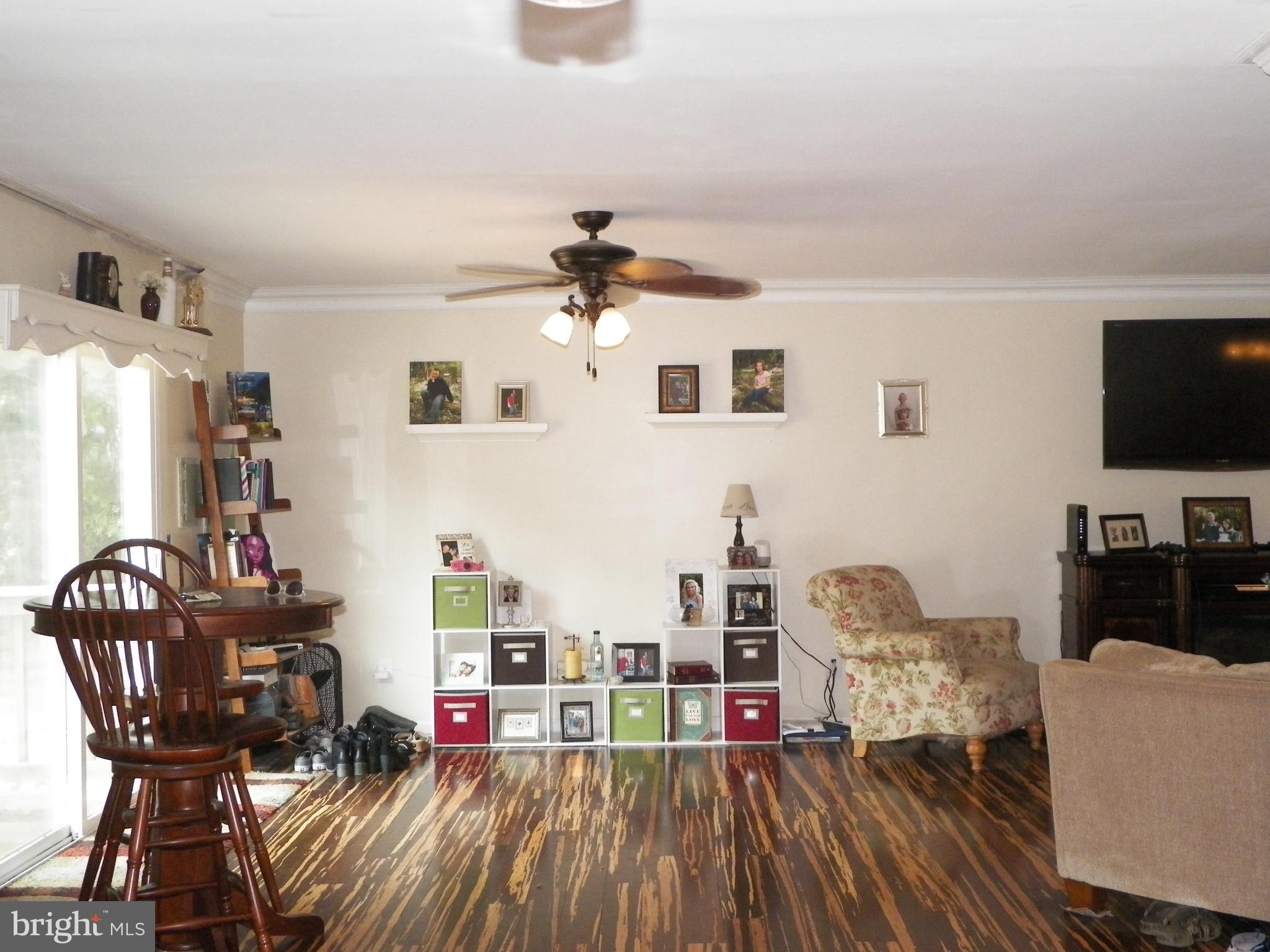 3151 Carroll Road Huntingtown, MD 20639 - Photo 8 of 30 a living room with furniture and a flat screen tv