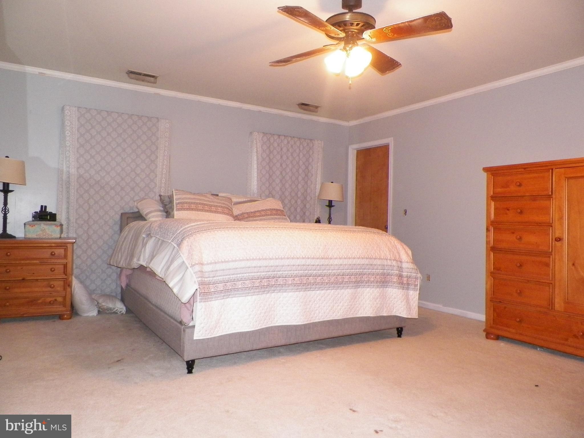 3151 Carroll Road Huntingtown, MD 20639 - Photo 10 of 30 a large bed sitting in a room