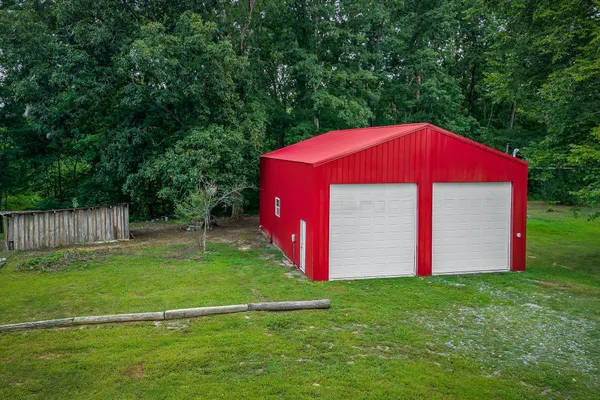 a view of a backyard with a small cabin