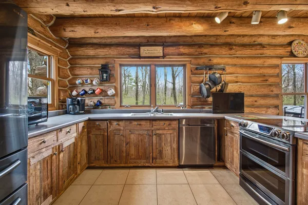 a kitchen with a sink and cabinets