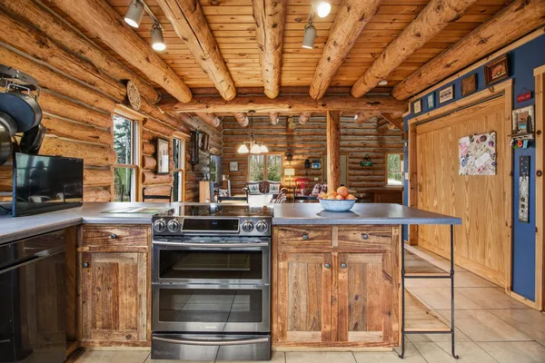 a kitchen with a stove and a sink