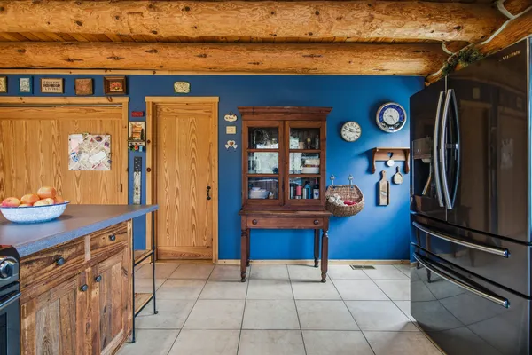 a kitchen with stainless steel appliances granite countertop a refrigerator and a stove