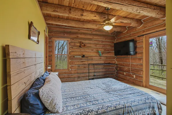 a bedroom with a bed and furniture