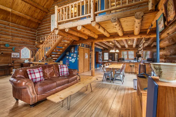 a outdoor living space with patio furniture and wooden floor