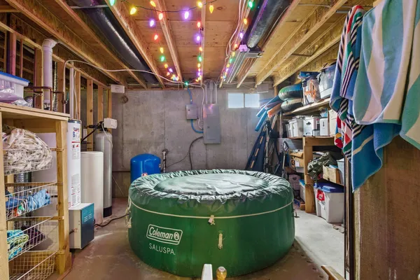 a view of a house with a yard and sitting area