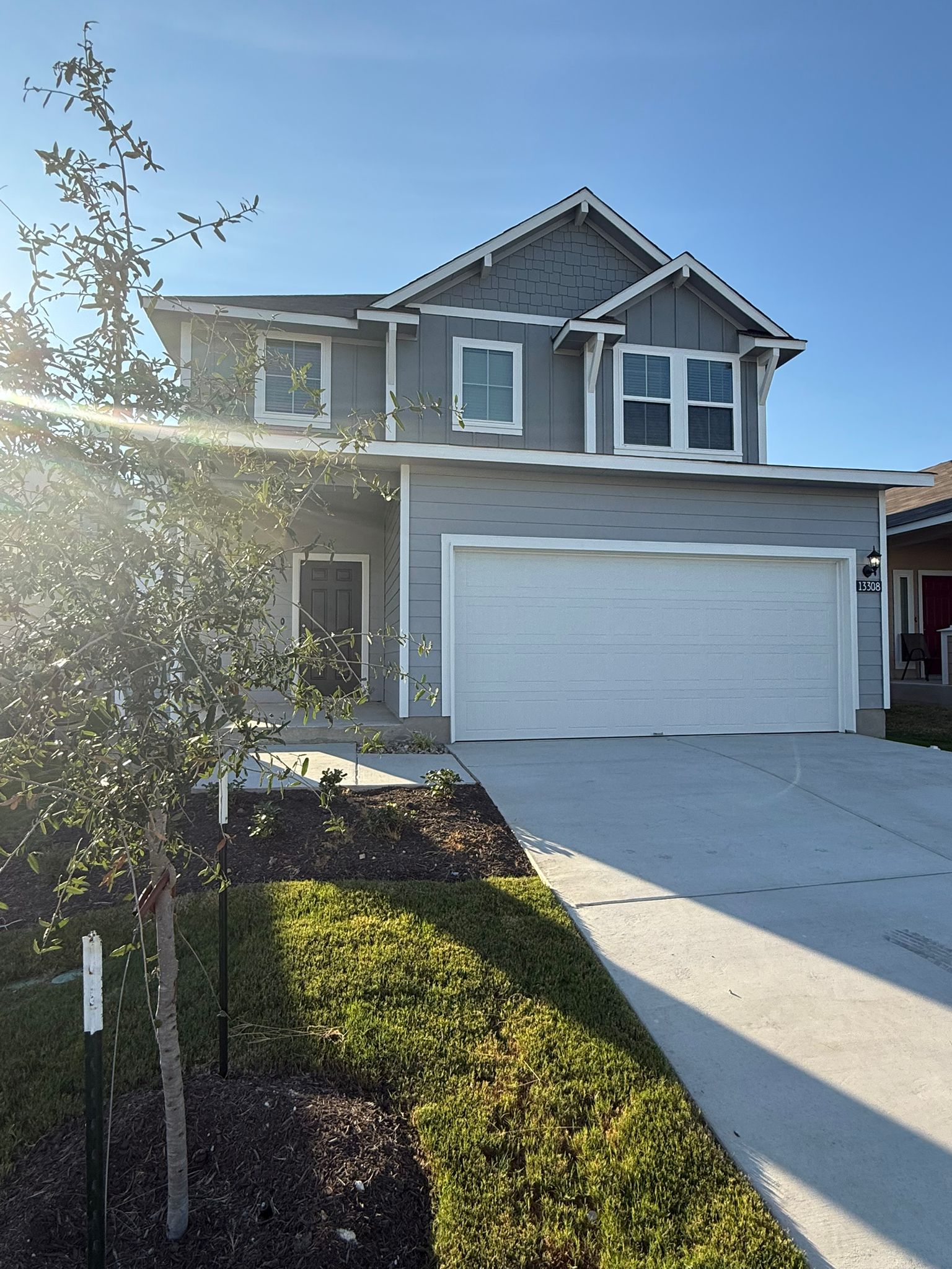 13308 Riding Drive Manor, TX 78653 - Photo 3 of 40 View of front of property with driveway and an attached garage