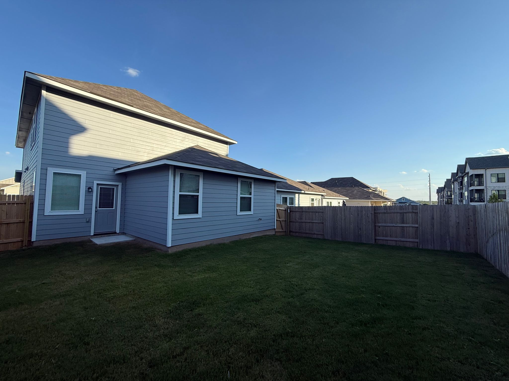 13308 Riding Drive Manor, TX 78653 - Photo 7 of 40 Back of house featuring a fenced backyard