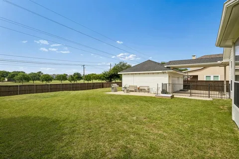 a view of a house with a big yard