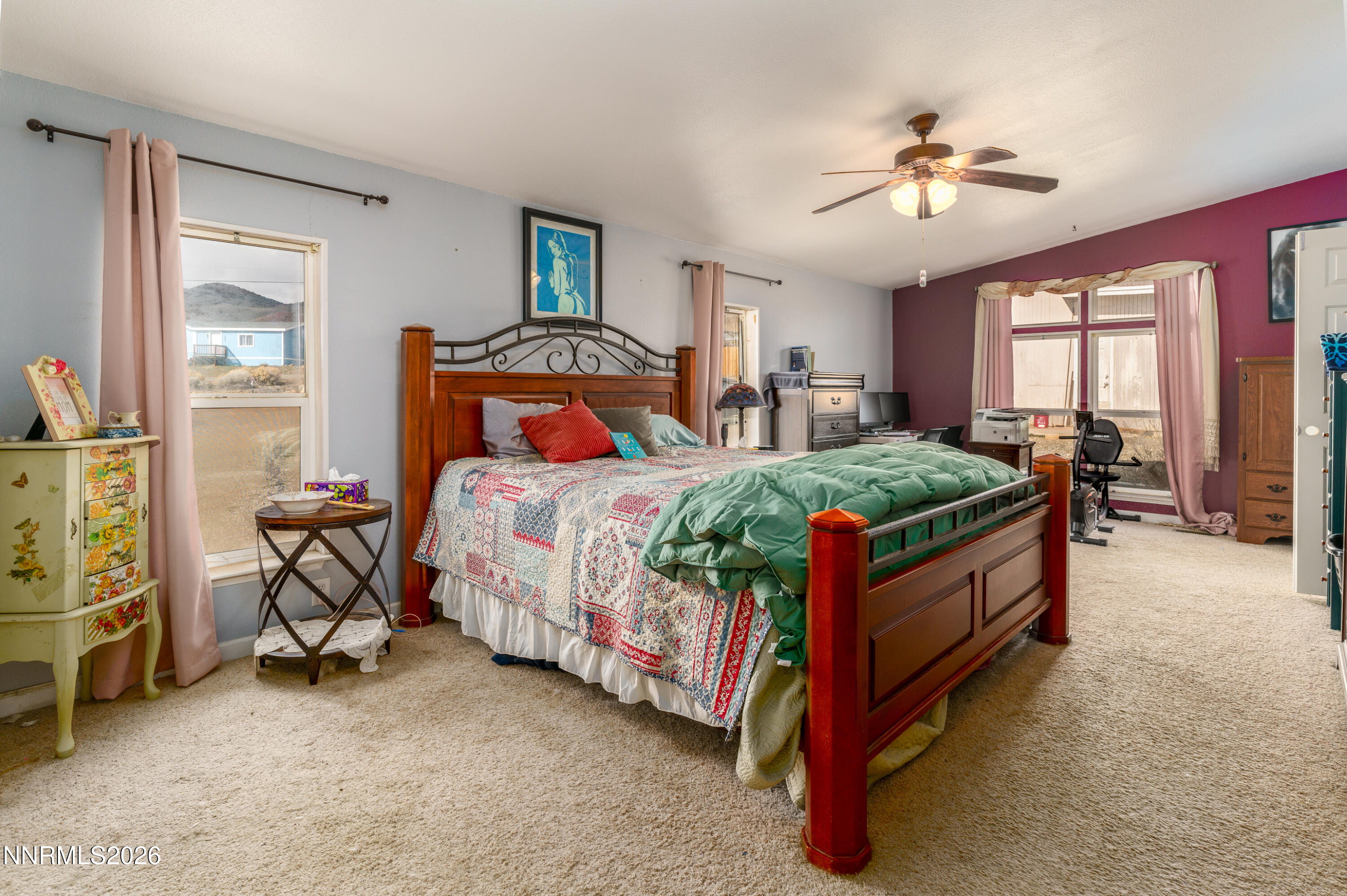 222 Julie Way Dayton, NV 89403 - Photo 14 of 28 a bedroom with a bed and a chandelier
