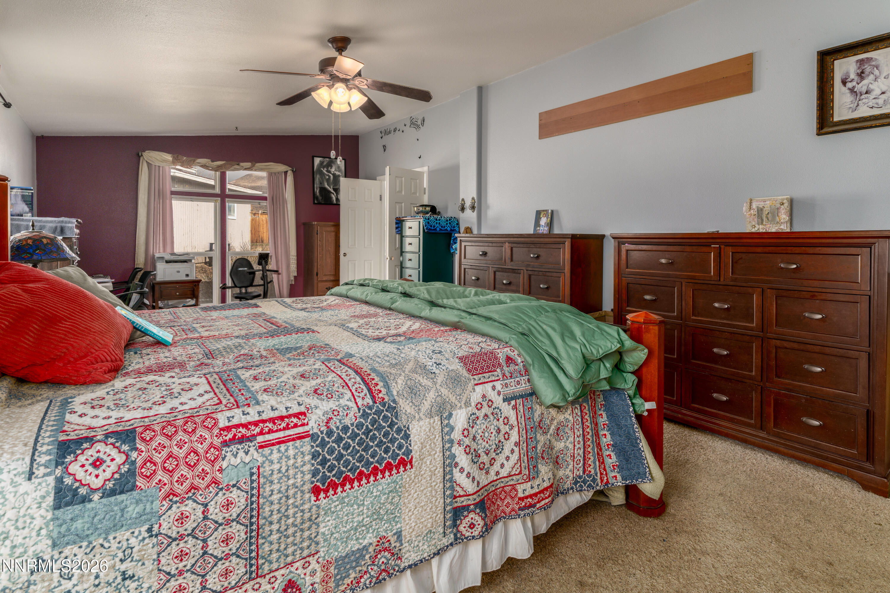 222 Julie Way Dayton, NV 89403 - Photo 15 of 28 a bedroom with a bed and a dresser in it