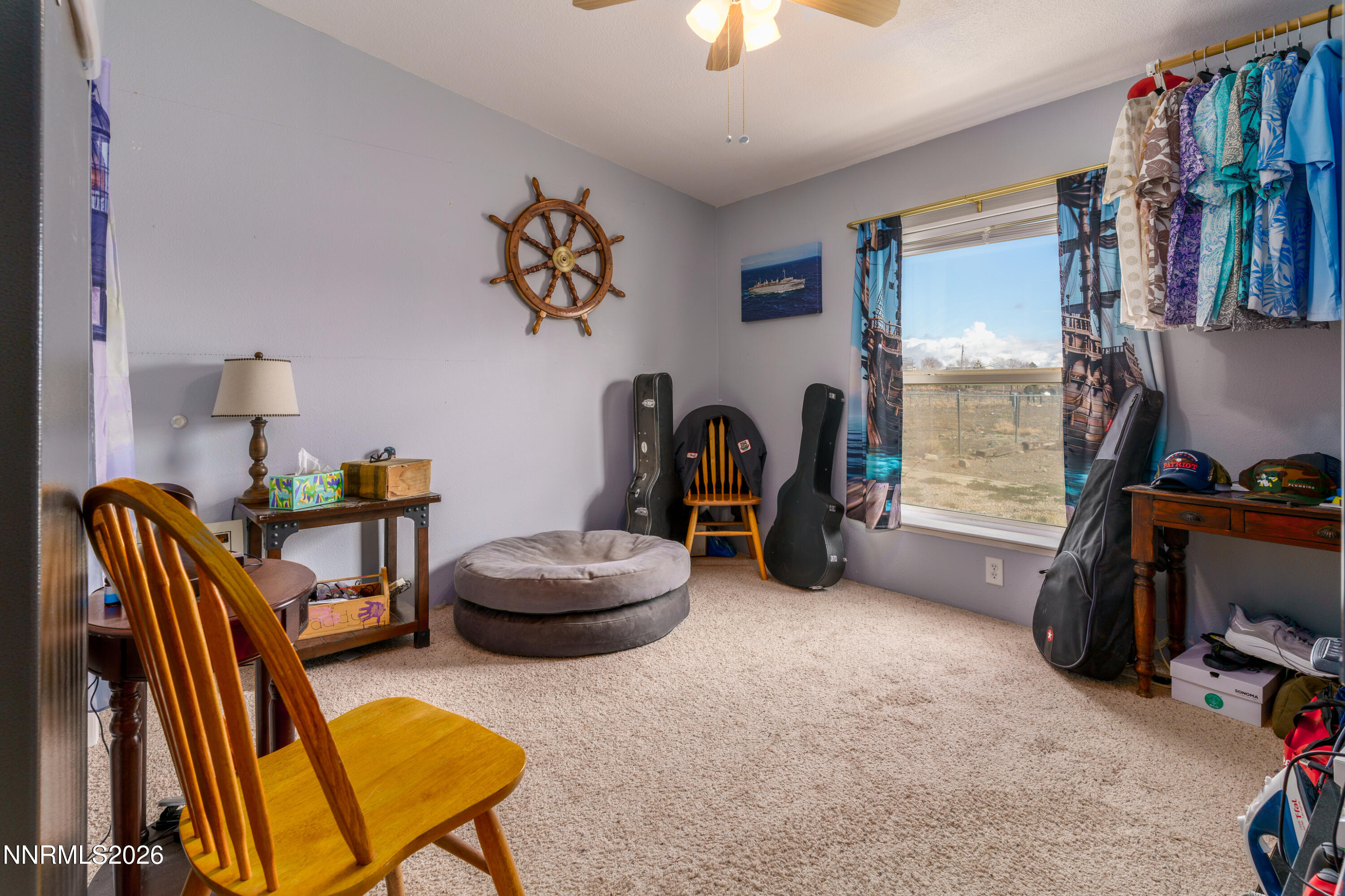 222 Julie Way Dayton, NV 89403 - Photo 17 of 28 a room with furniture and a flat screen tv