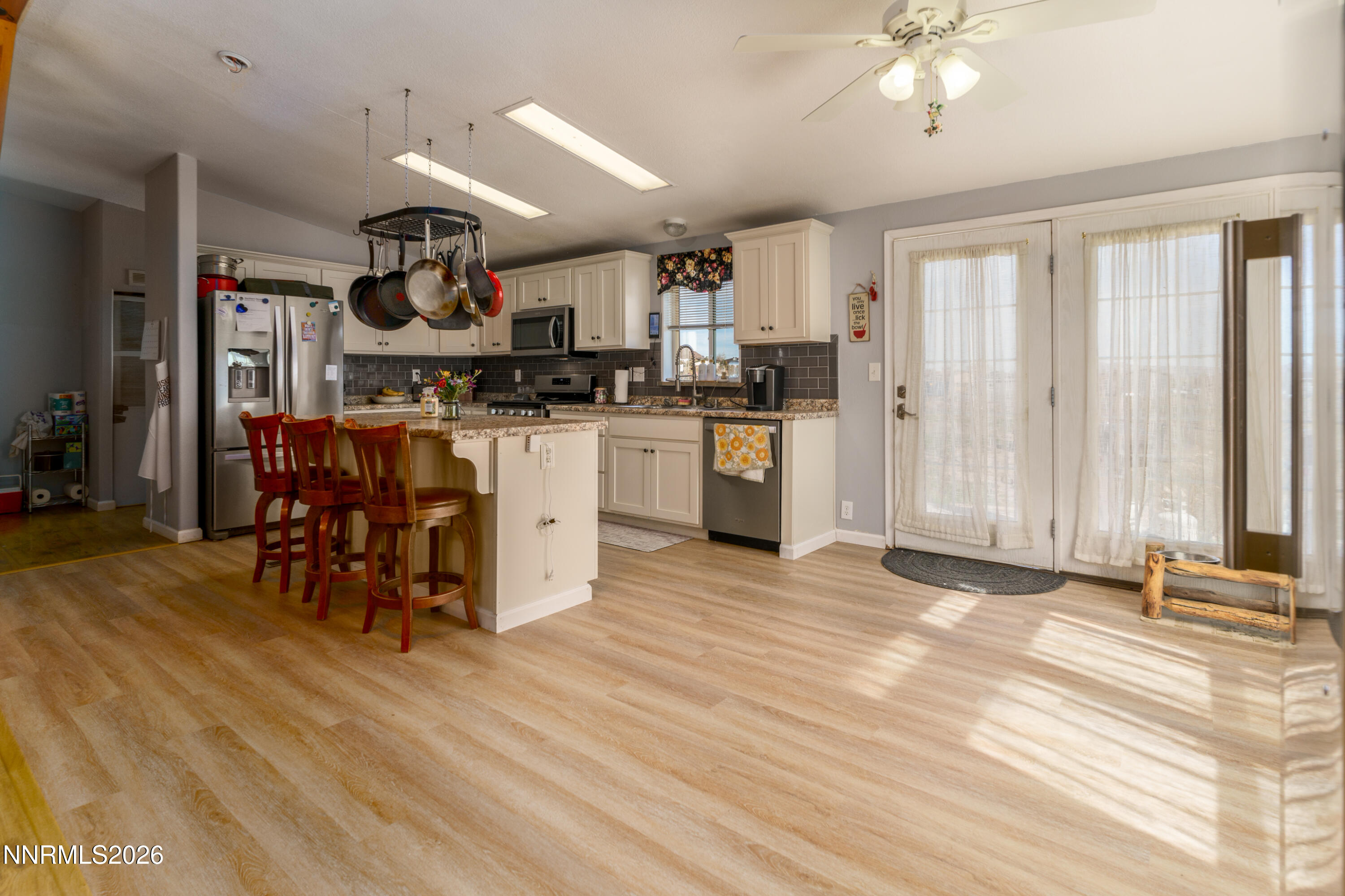 222 Julie Way Dayton, NV 89403 - Photo 7 of 28 a kitchen with stainless steel appliances granite countertop a refrigerator and a stove top oven