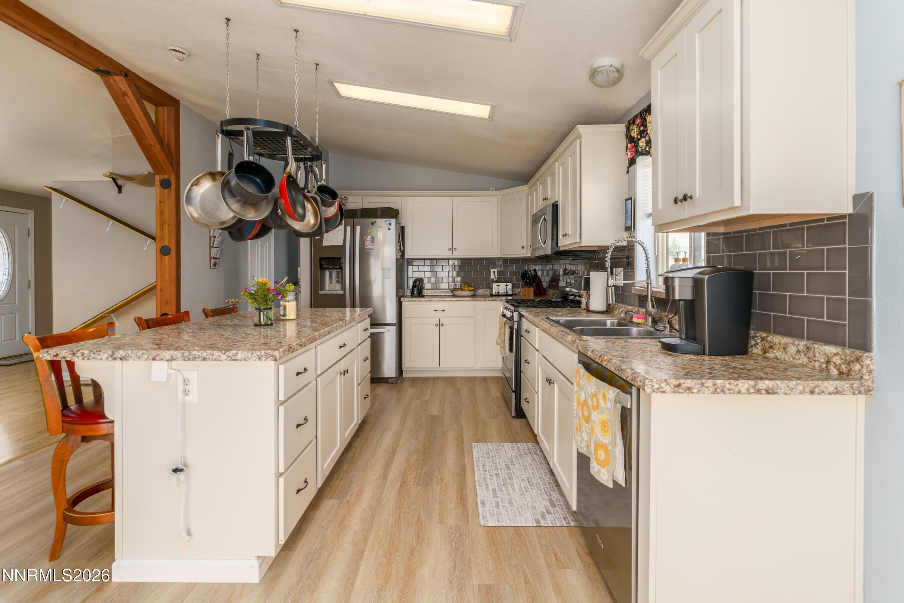 222 Julie Way Dayton, NV 89403 - Photo 8 of 28 a kitchen with stainless steel appliances granite countertop a sink stove and cabinets