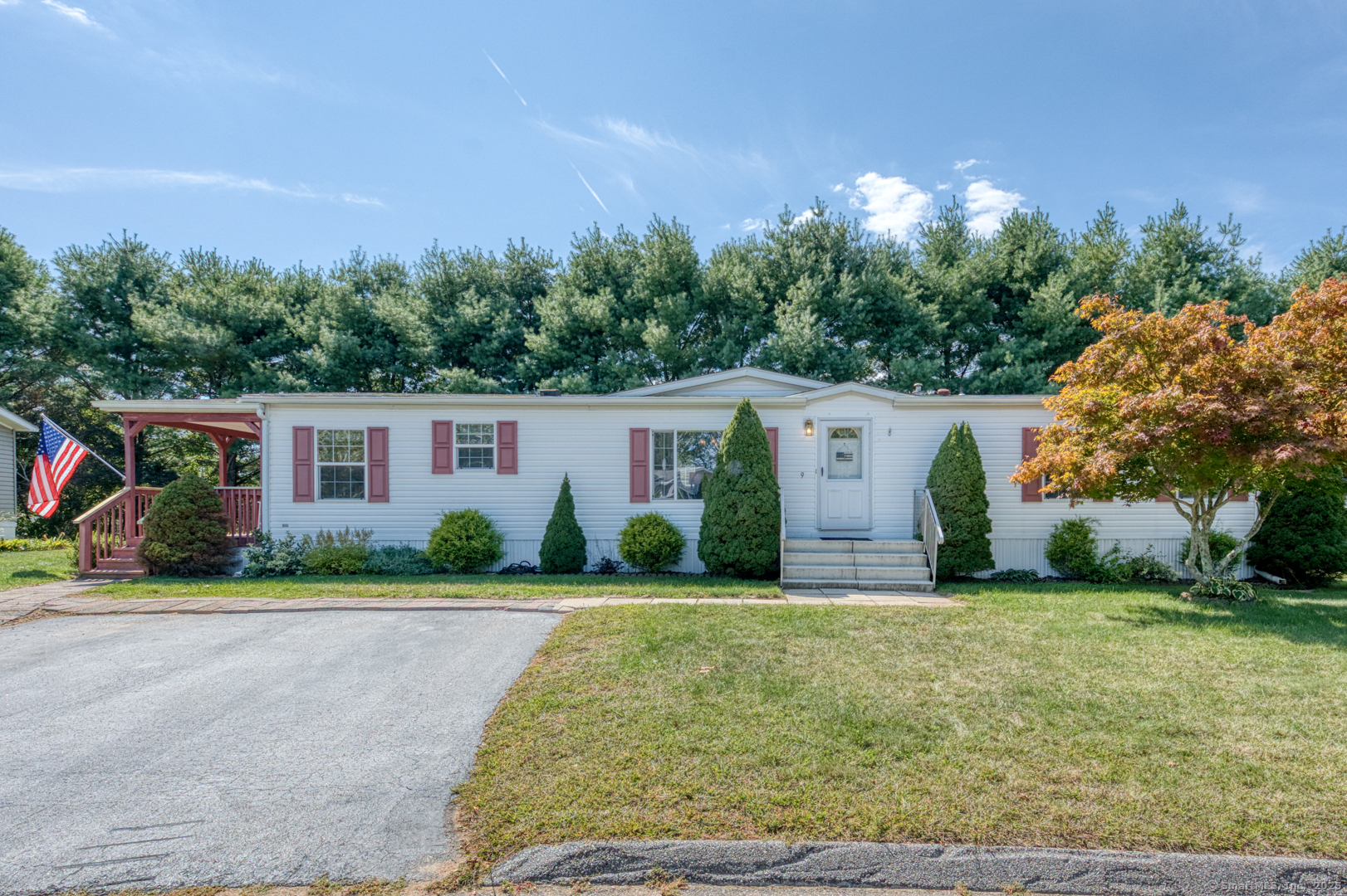 front view of a house with a yard