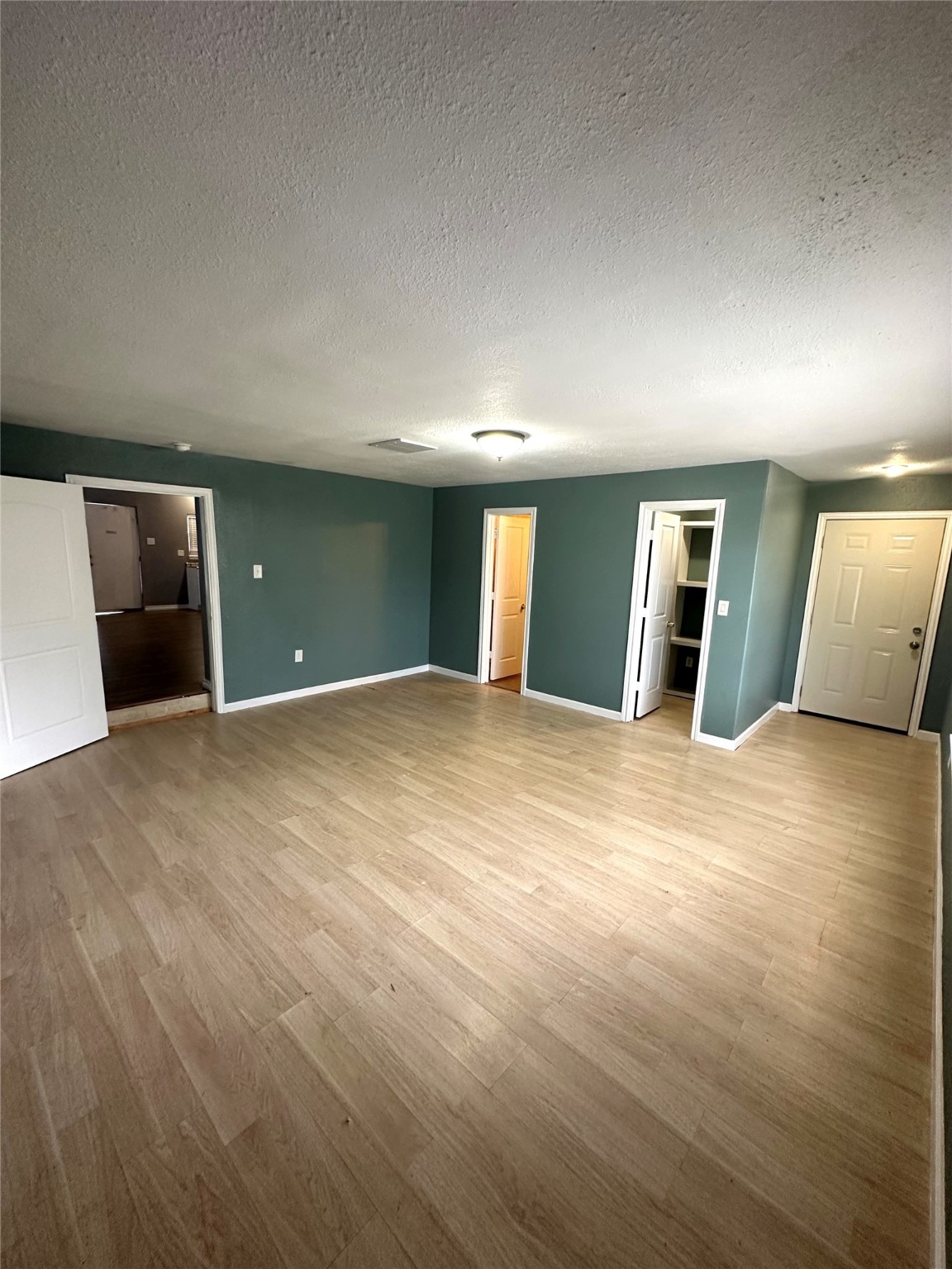 8611 Findlay Street Houston, TX 77017 - Photo 6 of 18 an empty room with wooden floor and windows