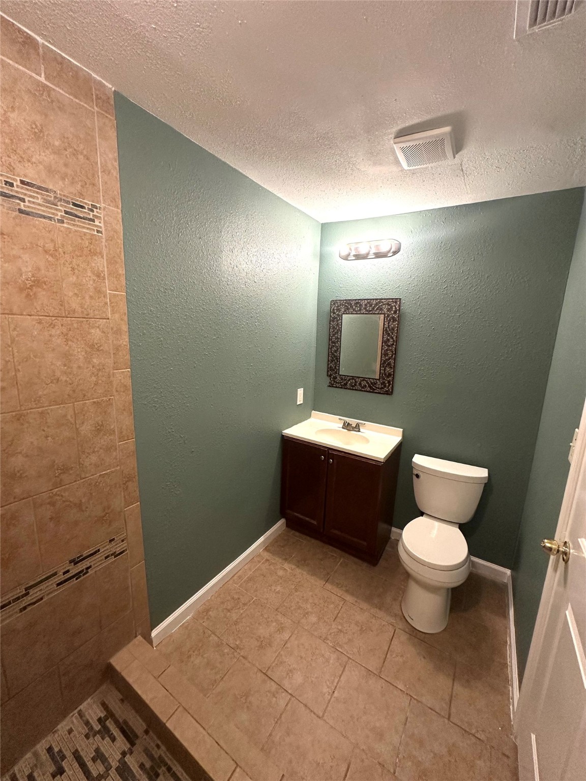 8611 Findlay Street Houston, TX 77017 - Photo 7 of 18 a bathroom with a toilet and a sink