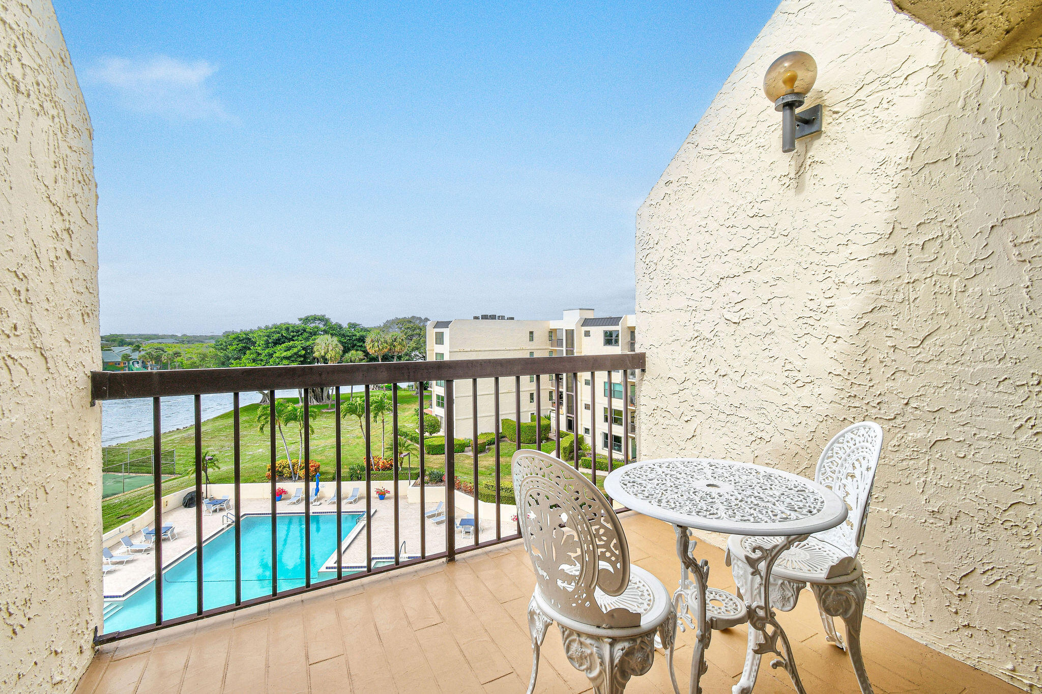 364 Golfview Road, Unit 506 North Palm Beach, FL 33408 - Photo 29 of 44 a view of a balcony with a table and chairs
