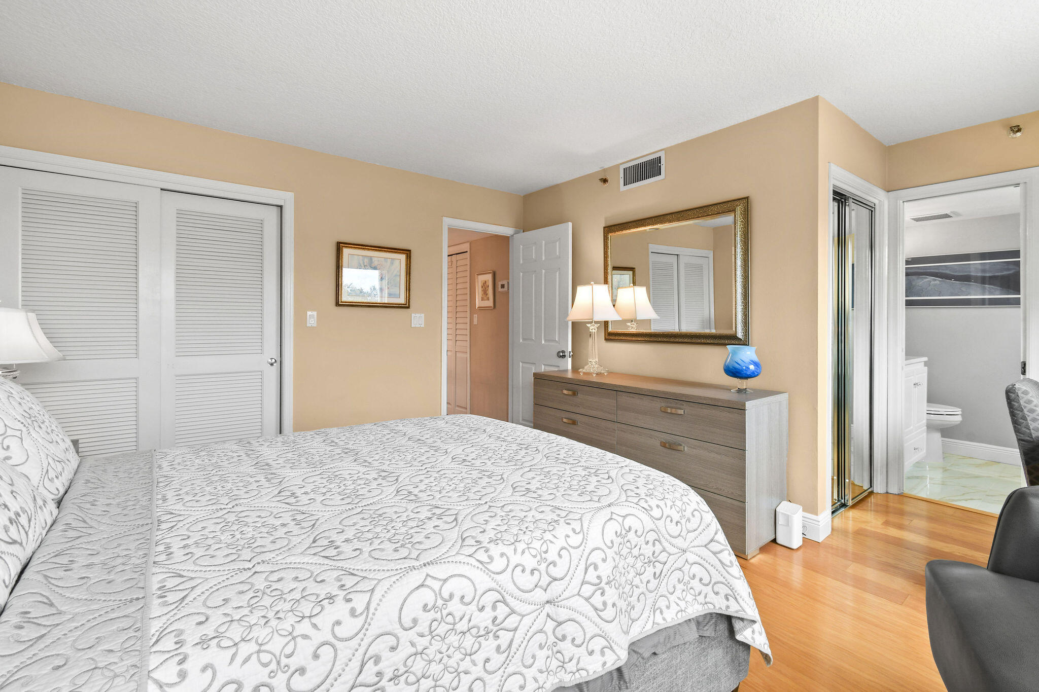 364 Golfview Road, Unit 506 North Palm Beach, FL 33408 - Photo 35 of 44 a bedroom with a bed and a dresser in it