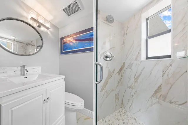 a bathroom with a toilet a sink and mirror