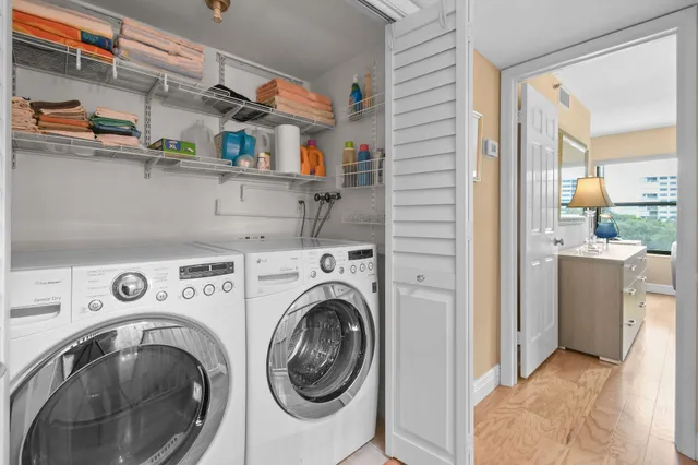 a view of storage and utility room with washer and dryer