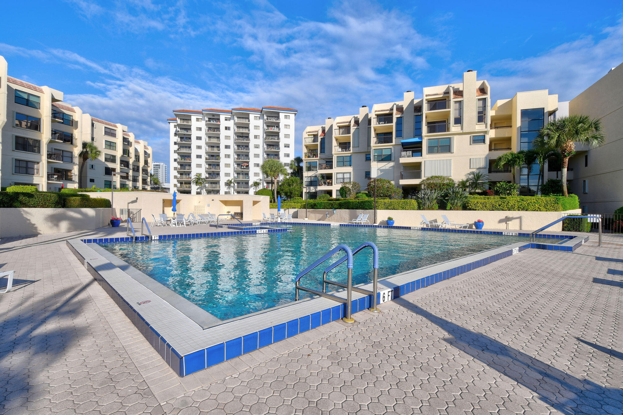 364 Golfview Road, Unit 506 North Palm Beach, FL 33408 - Photo 44 of 44 a view of a swimming pool with a lounge chairs