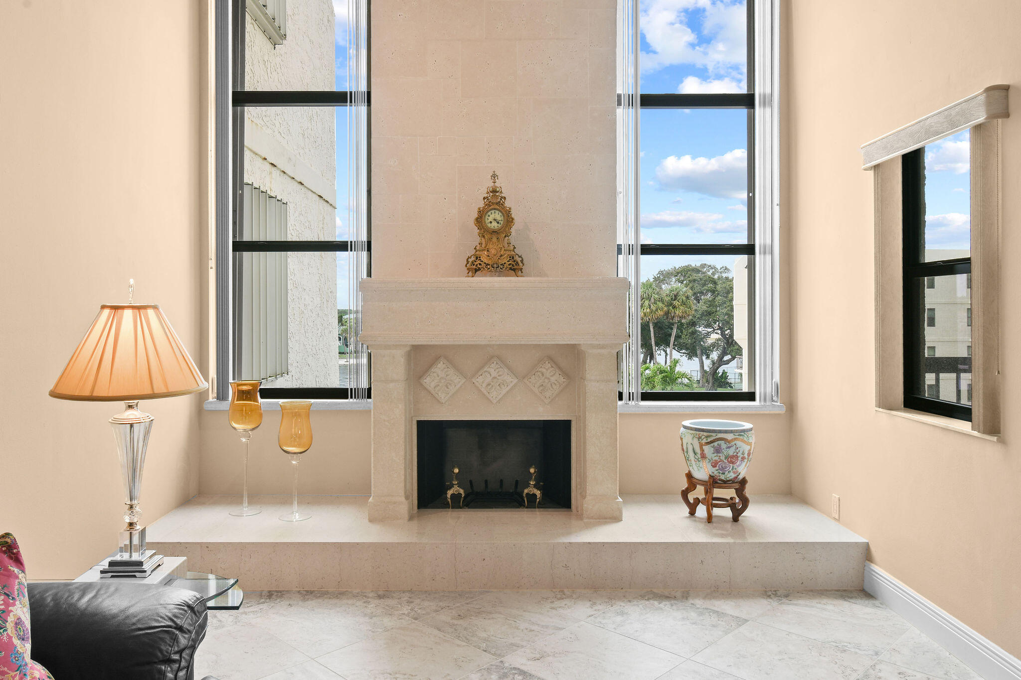 364 Golfview Road, Unit 506 North Palm Beach, FL 33408 - Photo 5 of 44 a living room with furniture and a fireplace