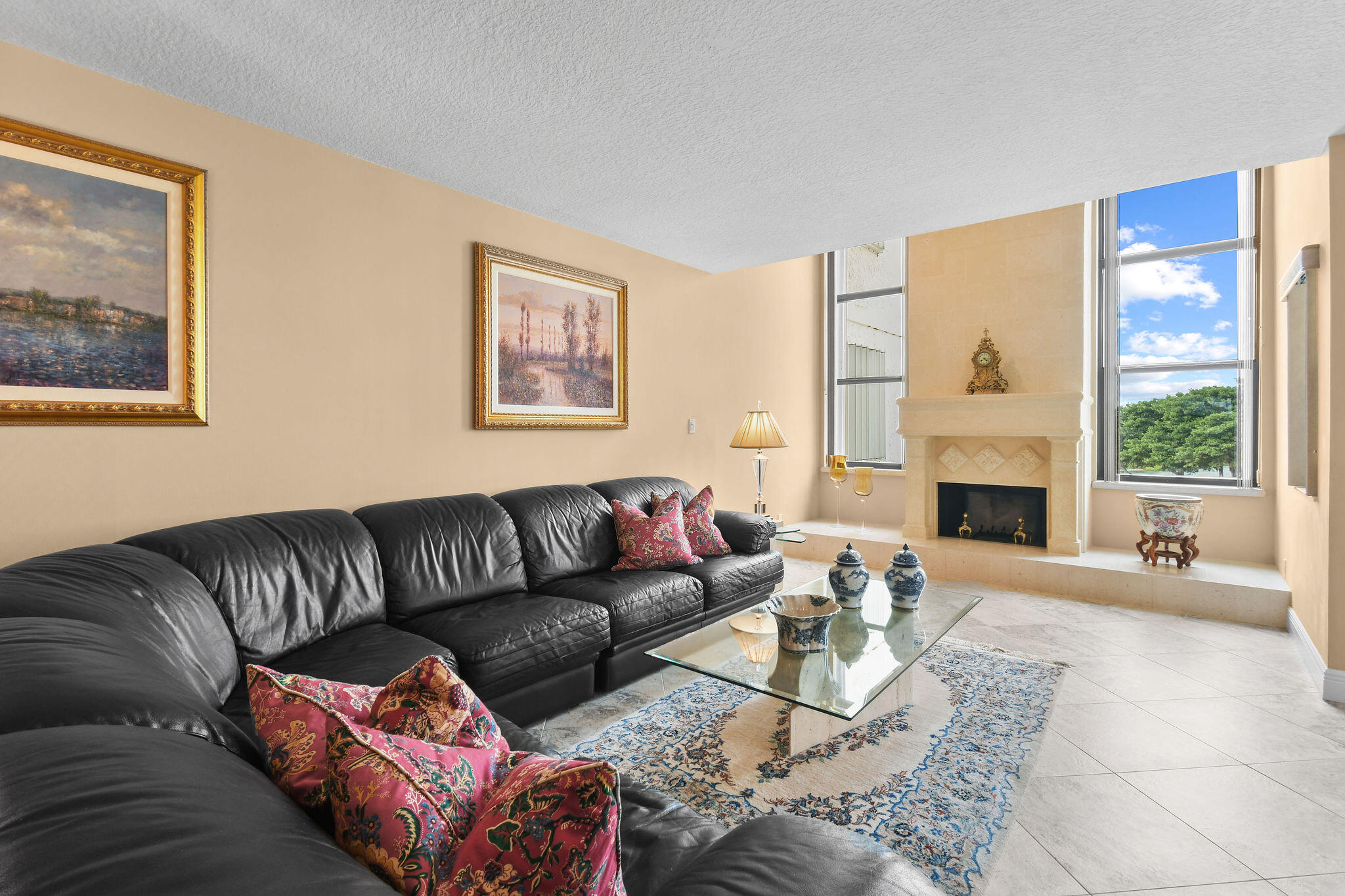 364 Golfview Road, Unit 506 North Palm Beach, FL 33408 - Photo 7 of 44 a living room with furniture a fireplace and a large window